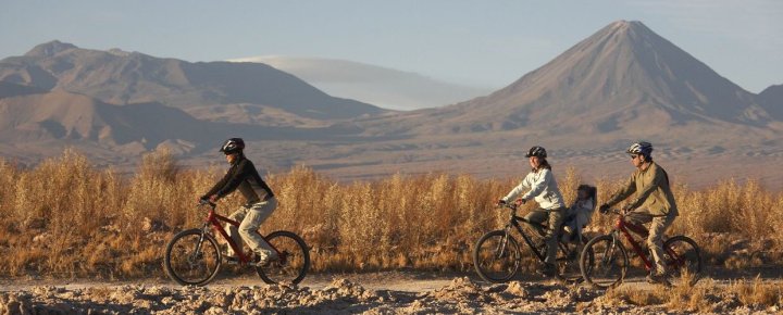 Explorers-riding-mountain-bikes-in-the-Atacama-Desert-Chile.-Camping-mh5p9ek82ap7z1ct2puy5chpo35ekf51omzr4gtdhk